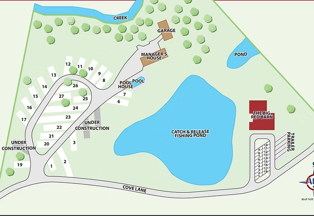 Map of a lakeside park with roads, trees, trails, buildings, and a large blue lake.