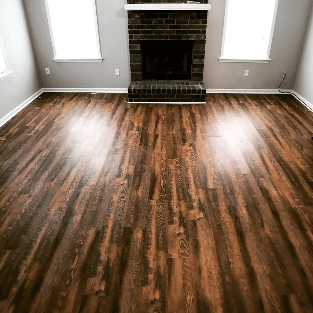 Empty living room with dark wood floors, a black fireplace, and two windows letting in light