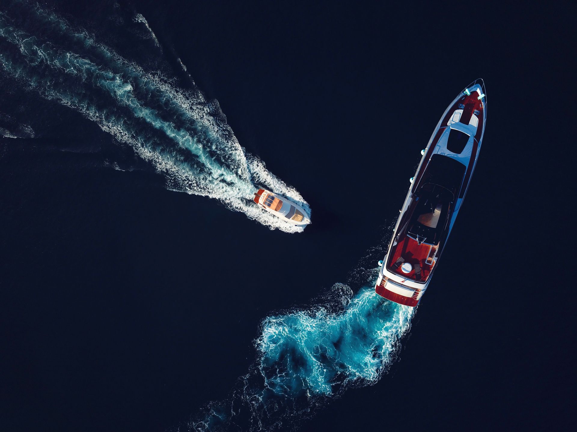 An Aerial View of Two Boats Floating on Top of a Body of Water - High Point, NC - Zimmerman Insurance