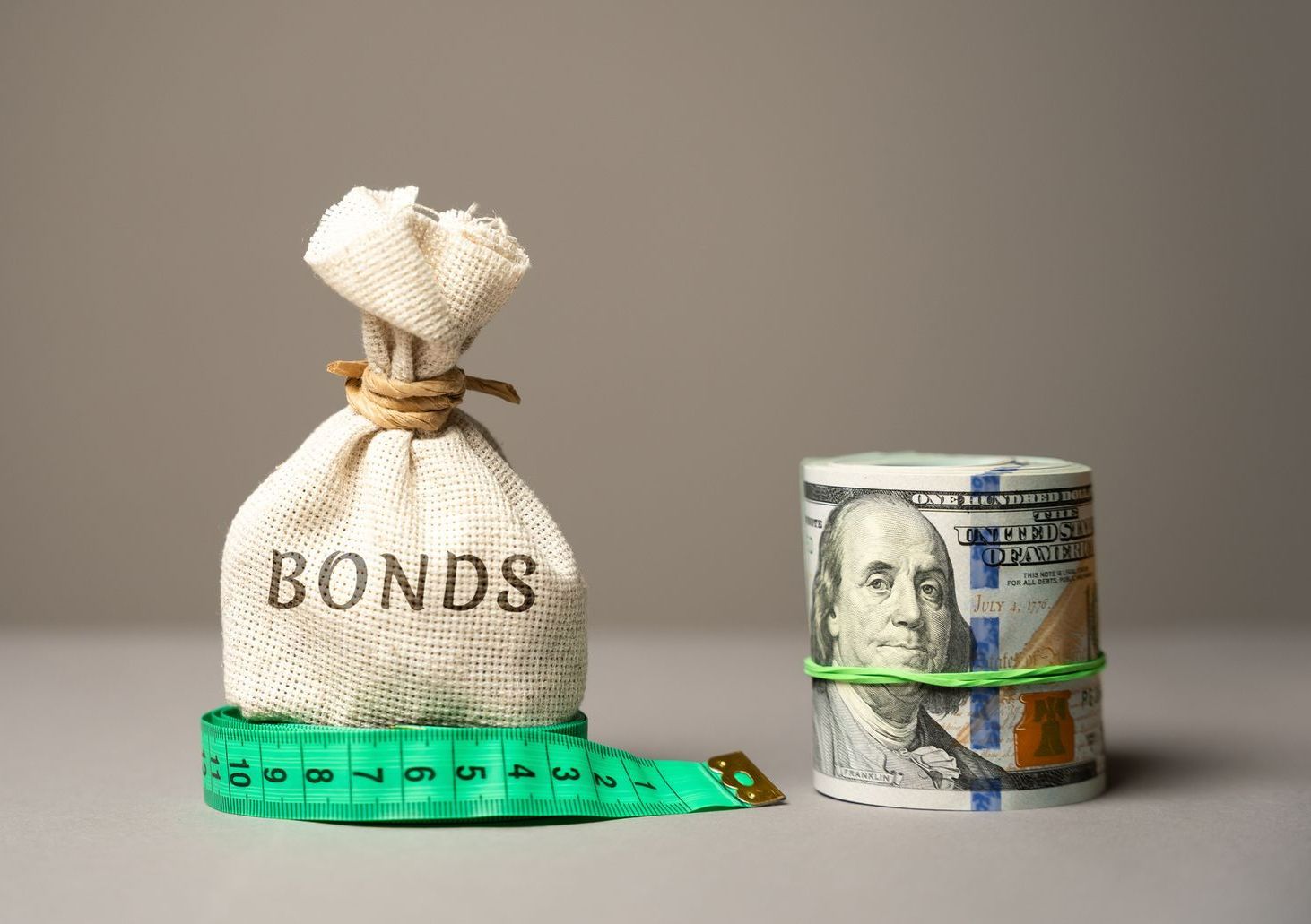 A Bag of Bonds Next to a Roll of Money and a Measuring Tape - High Point, NC - Zimmerman Insurance