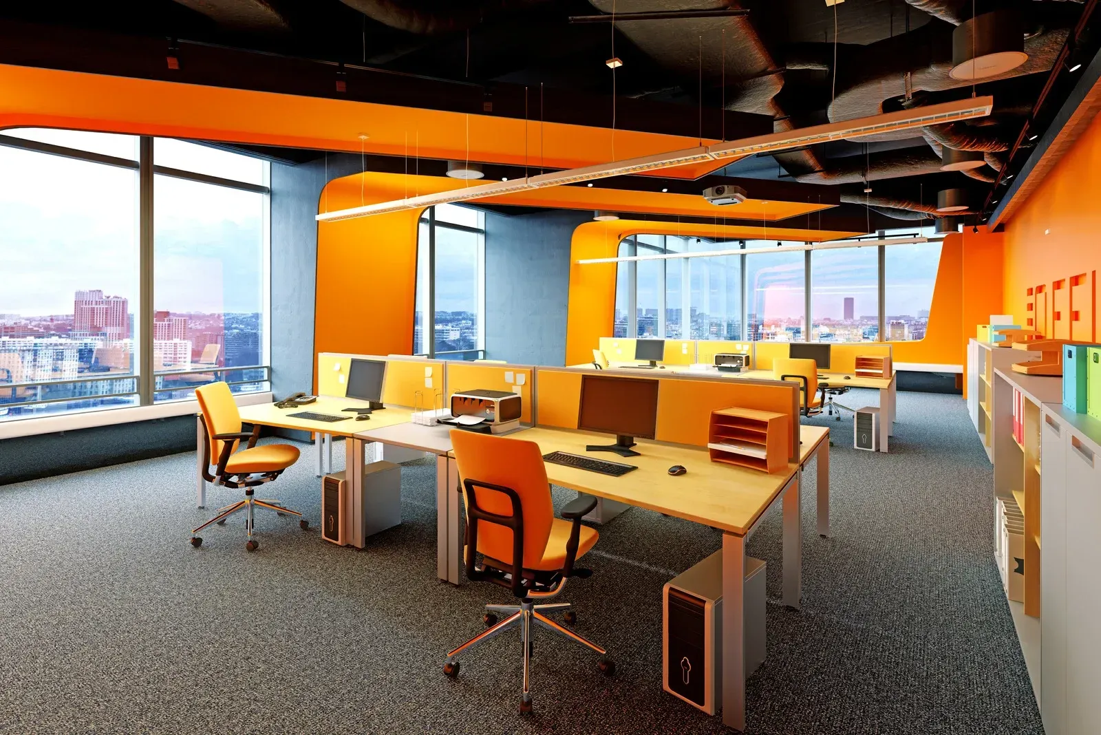 An office with a lot of desks and chairs and a lot of windows.