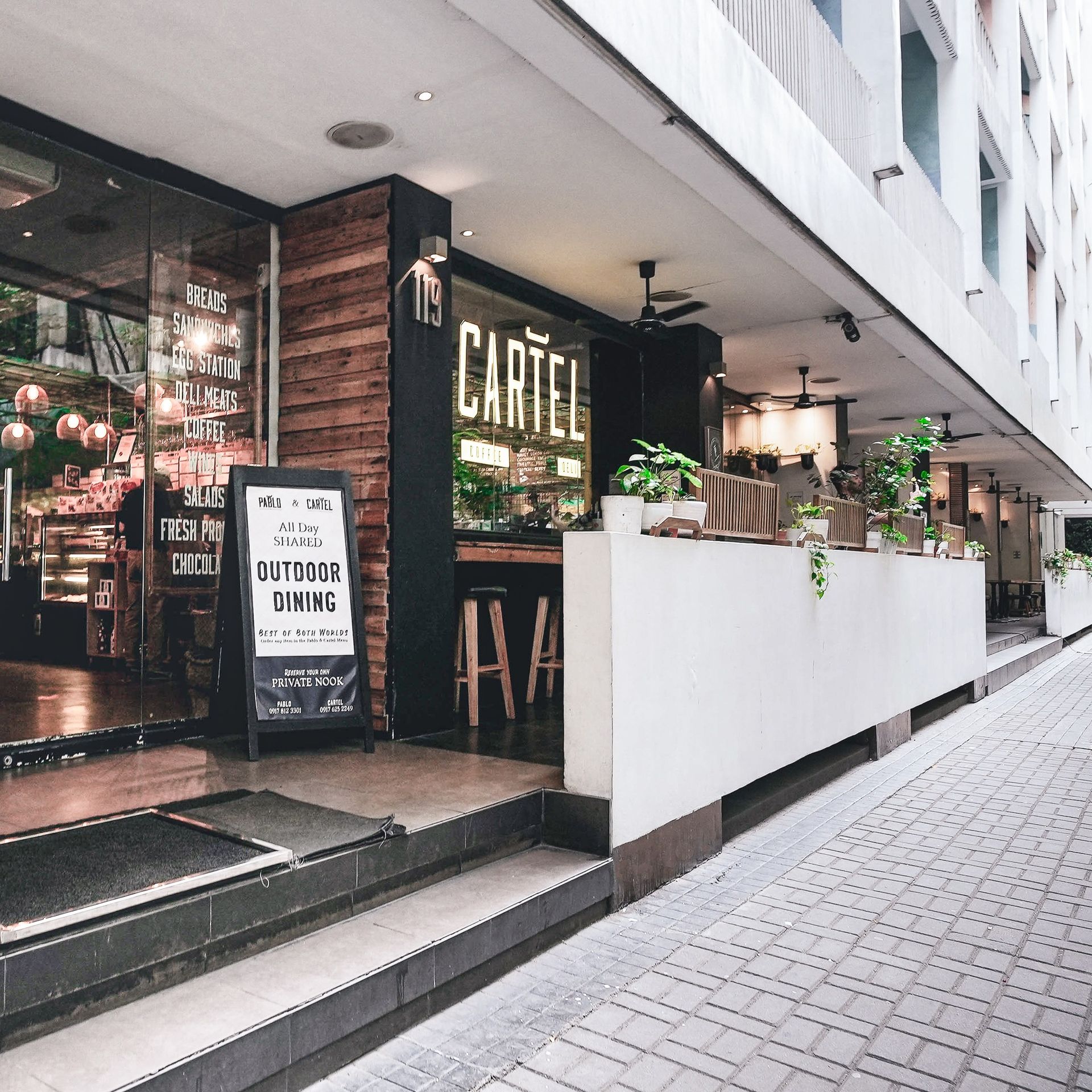 Street view of Makati serviced residence Cartel Deli restaurant