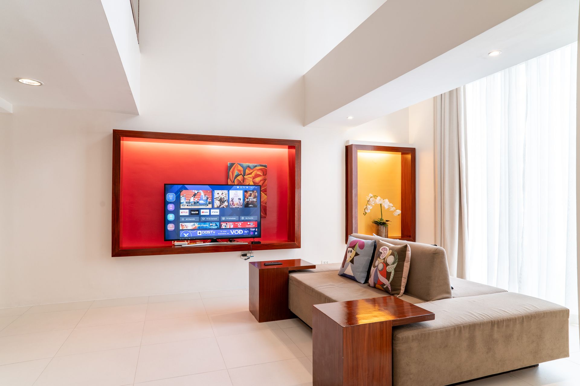 A living room with a couch and a flat screen tv