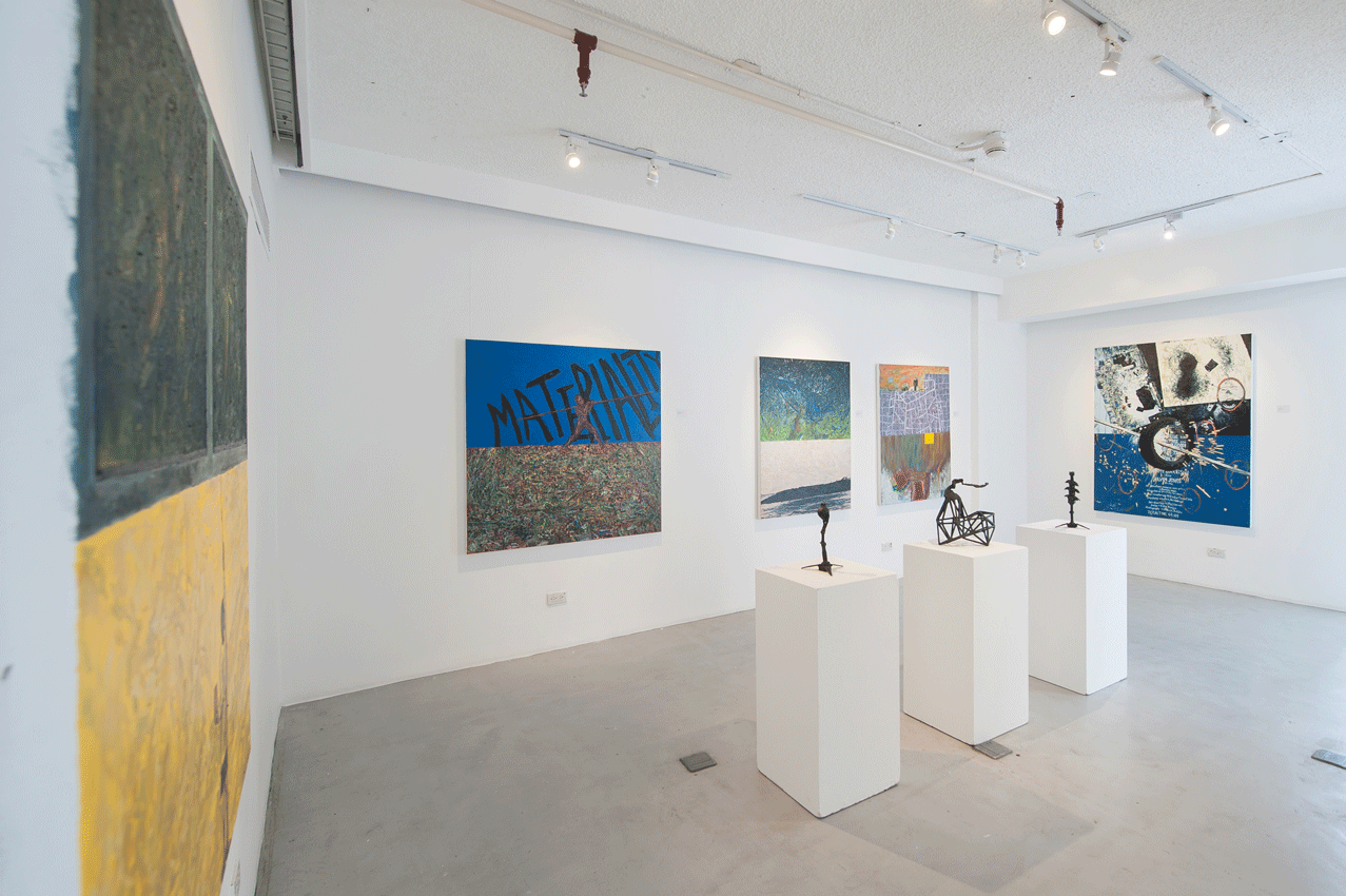 Contemporary art gallery with paintings and sculptures on white pedestals