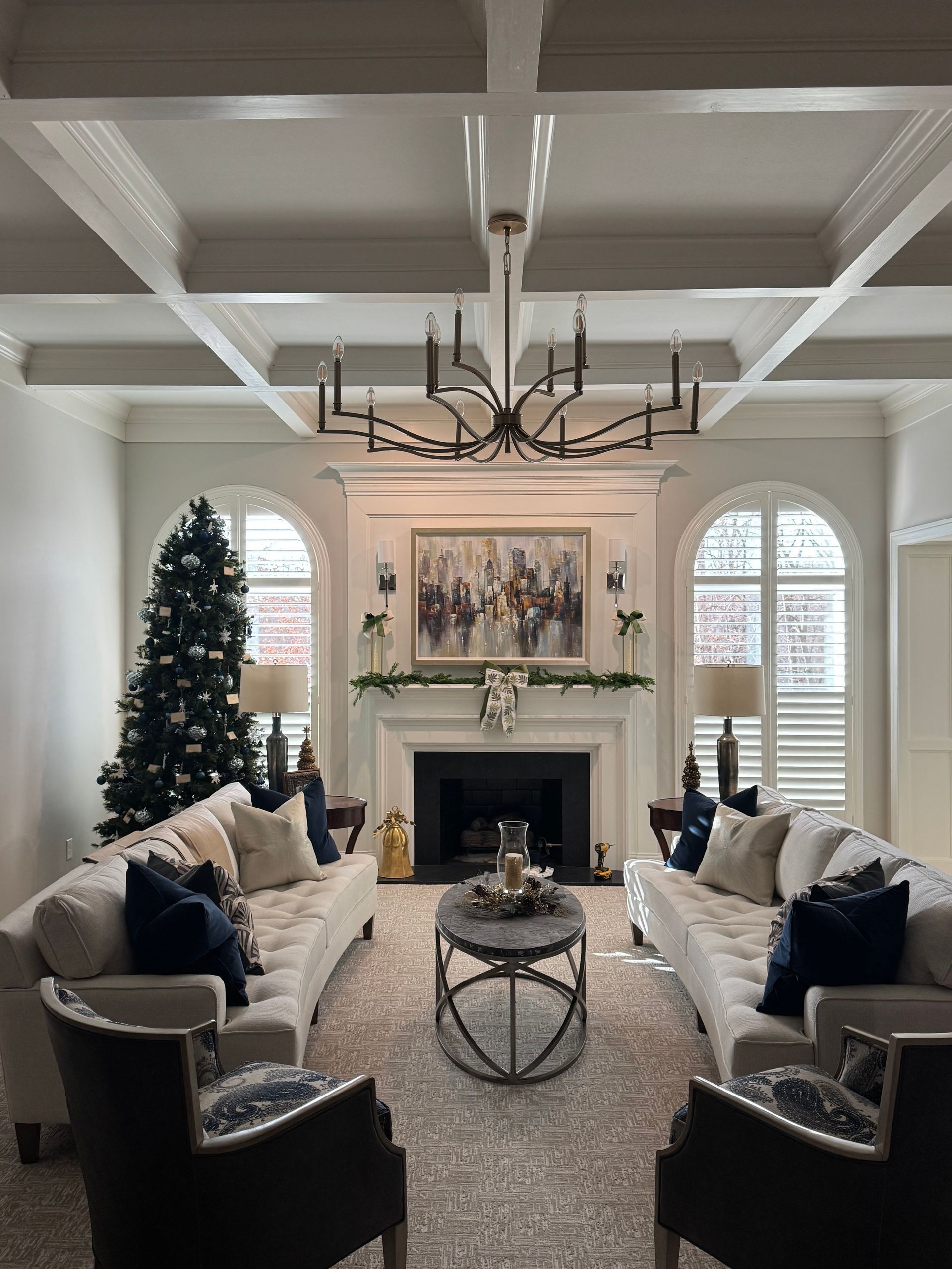 A living room filled with furniture and a christmas tree.