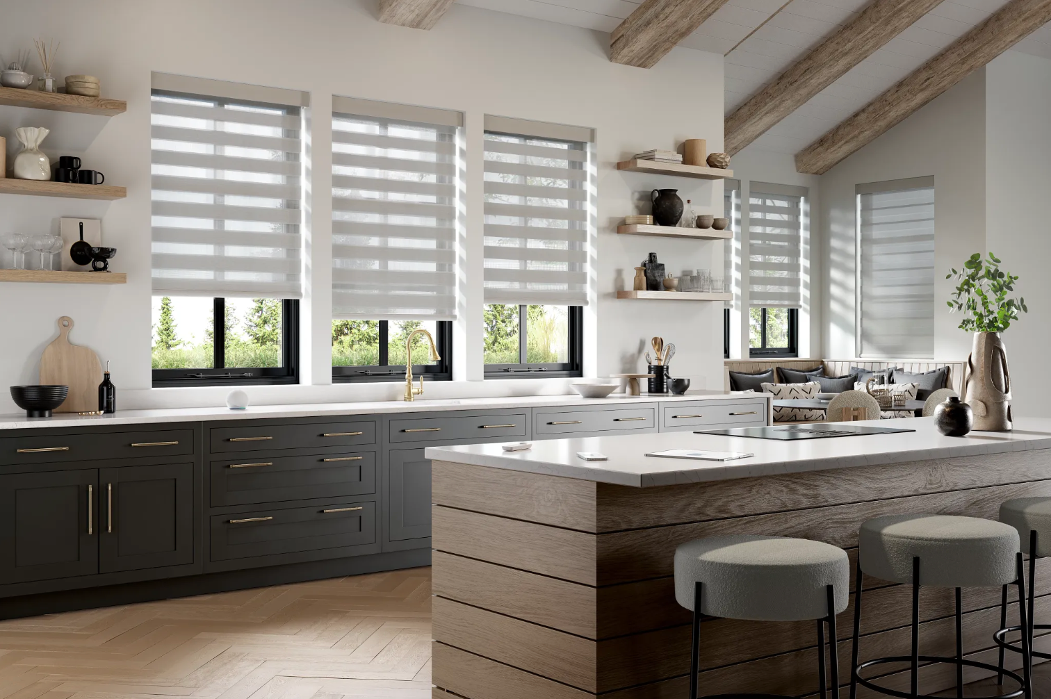 A kitchen with a large island and a lot of windows.