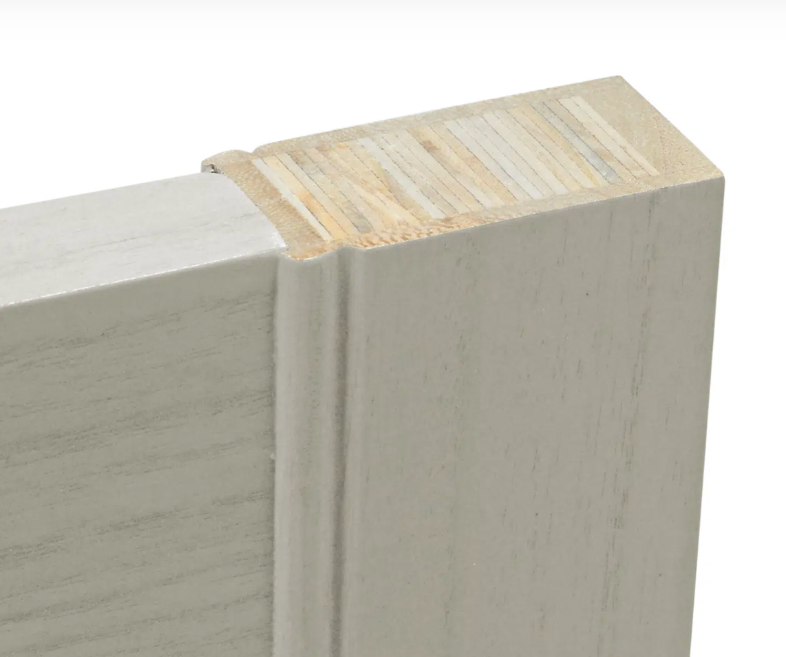 A close up of a piece of wood on a white background.