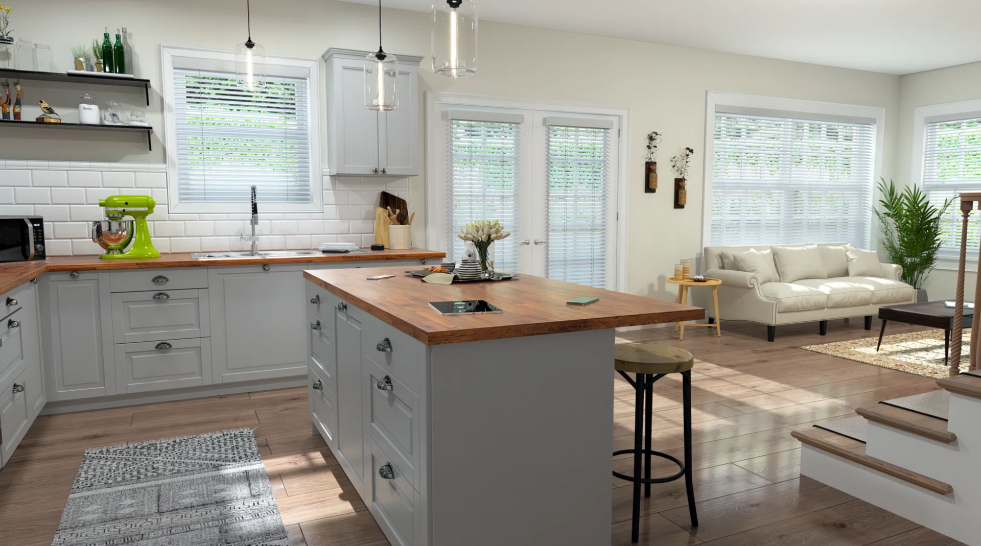 A kitchen with a large island in the middle of it and a couch.