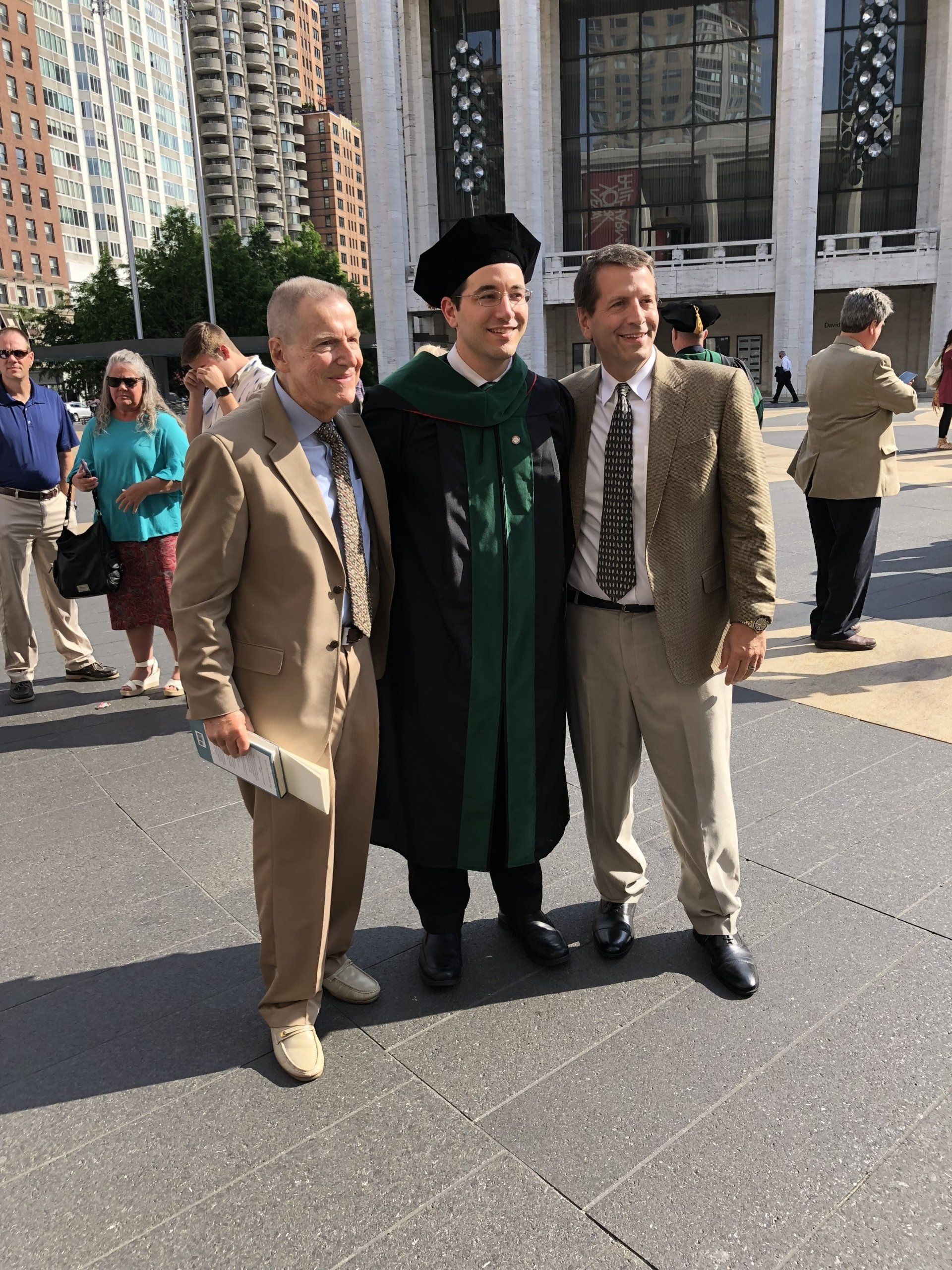 Dr. John Norris's father, John Norris, is seen with his son, Matthew Norris, attending Matthew's (MD) graduation. Three Dr. Norris's in the family now.