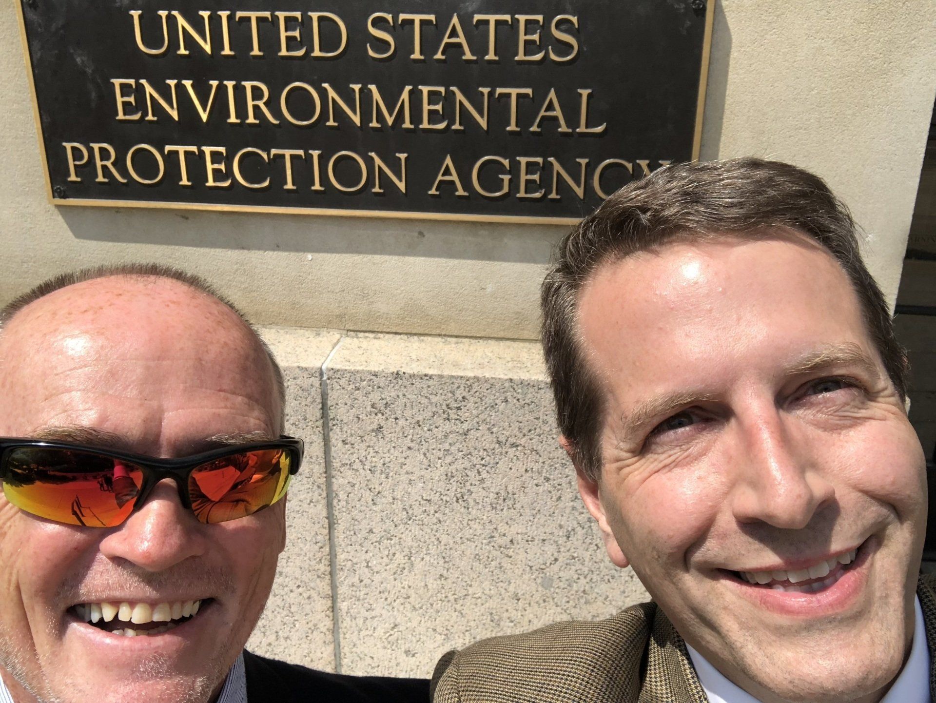 Dr. Norris visiting DC to educate on GM Mosquitoes (2016) at the Environmental Protection Agency sign.
