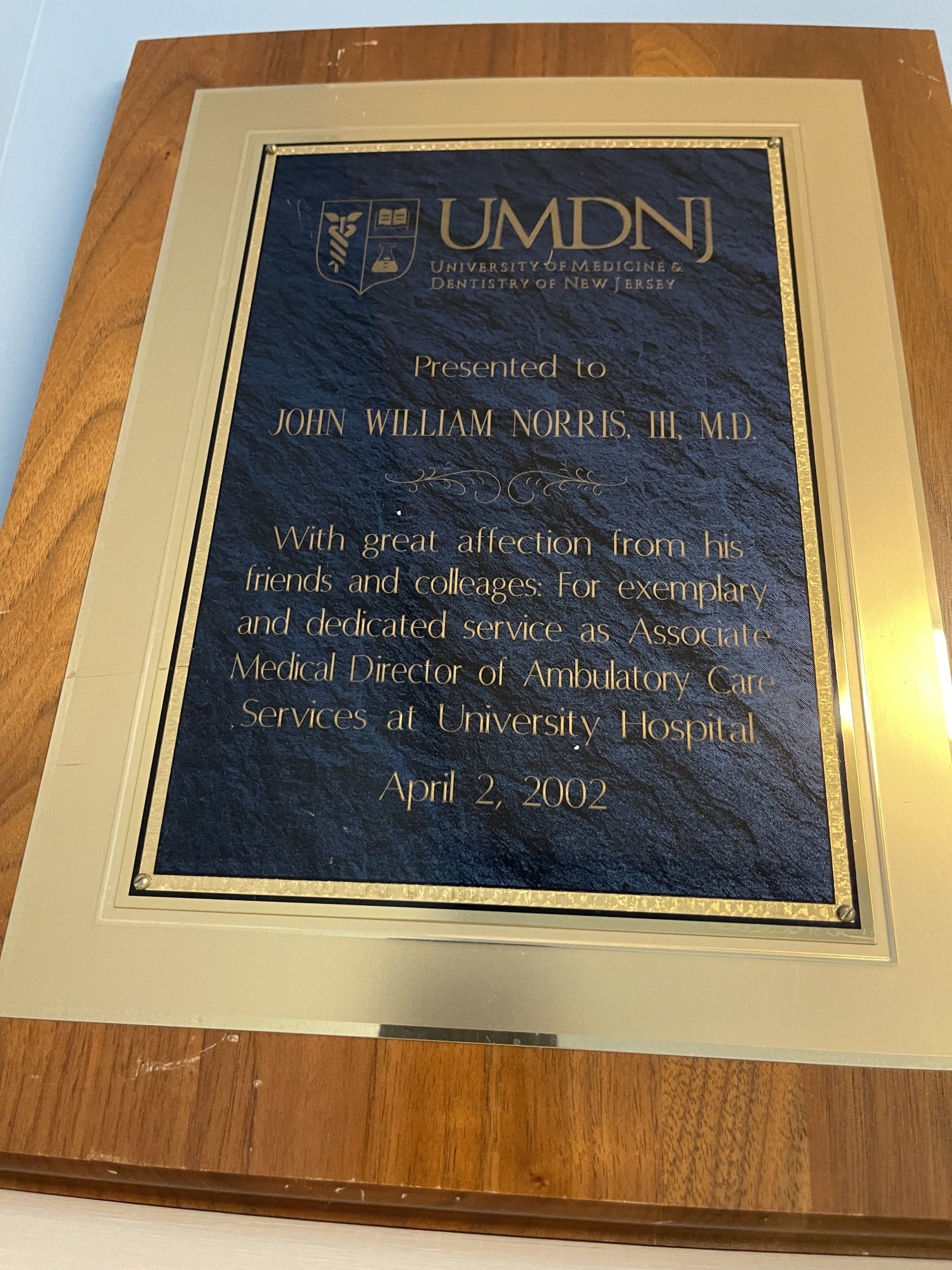 Plaque from UMDNJ: Presented to John William Norris, MD. April 2, 2002.