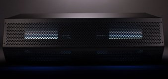 A black box with holes in it is sitting on a table.