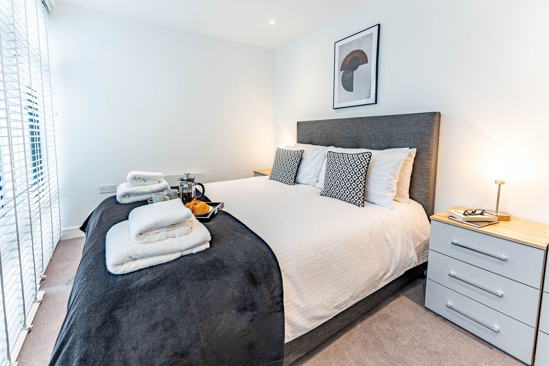 wellington house bedroom with folded towels and food tray from the housekeeping team
