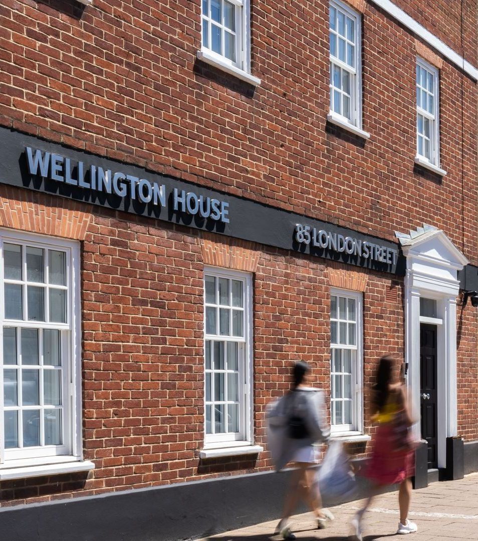 Red-brick building with a sign reading
