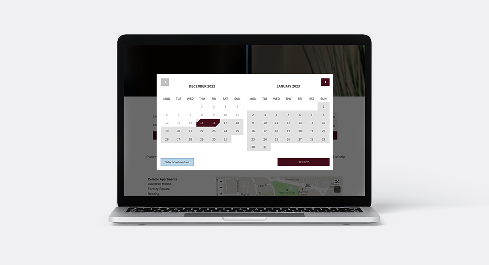 Laptop screen displaying a date picker modal showing two calendar months with selected dates in maroon.