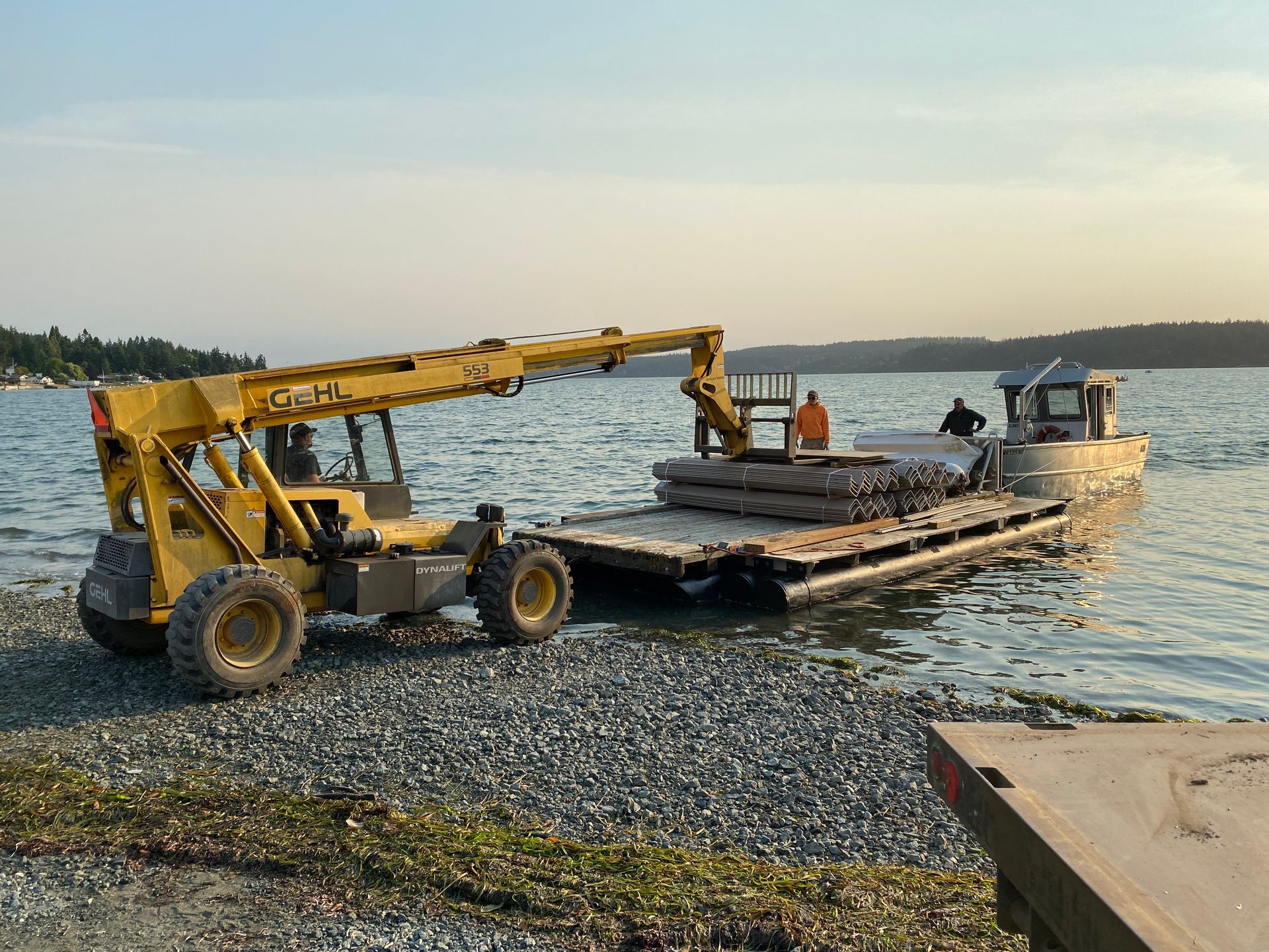 Crew members in PFDs conducting safe barge operations on Puget Sound