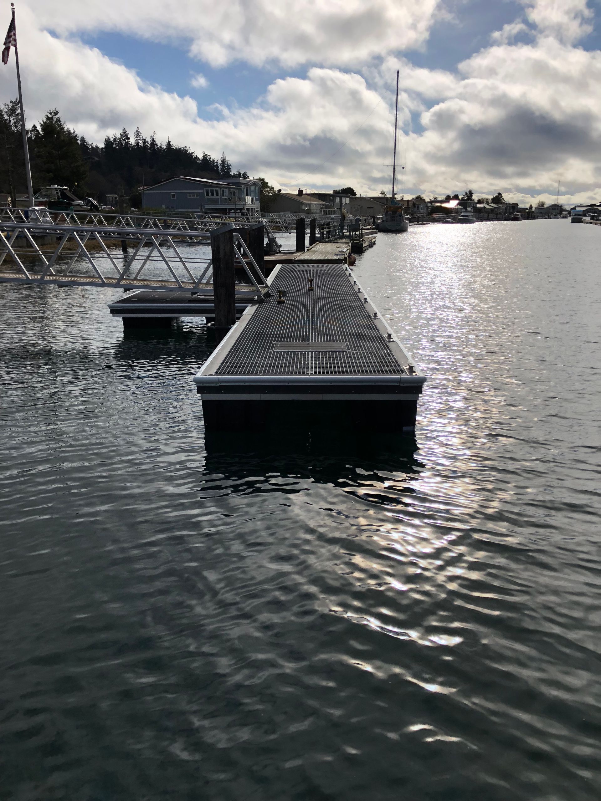 Residential aluminum gangway and floating dock at high tide