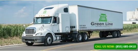White Green Line semi-truck driving on a road with green text 