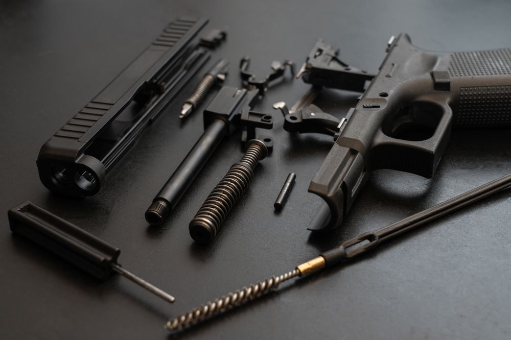 pistol in pieces on a table