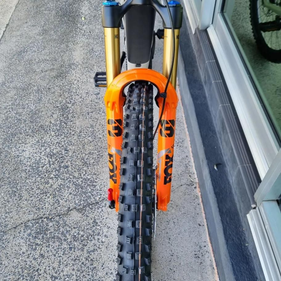A Fox Brand Bicycle Is Parked On A Sidewalk — Trinity Cycle Works In Cairns City, QLD