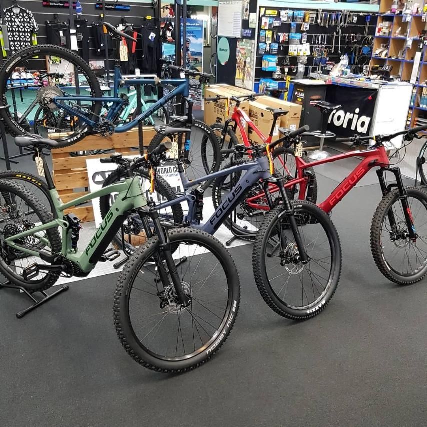 A Row Of Bicycles Are Lined Up In A Store — Trinity Cycle Works In Cairns City, QLD