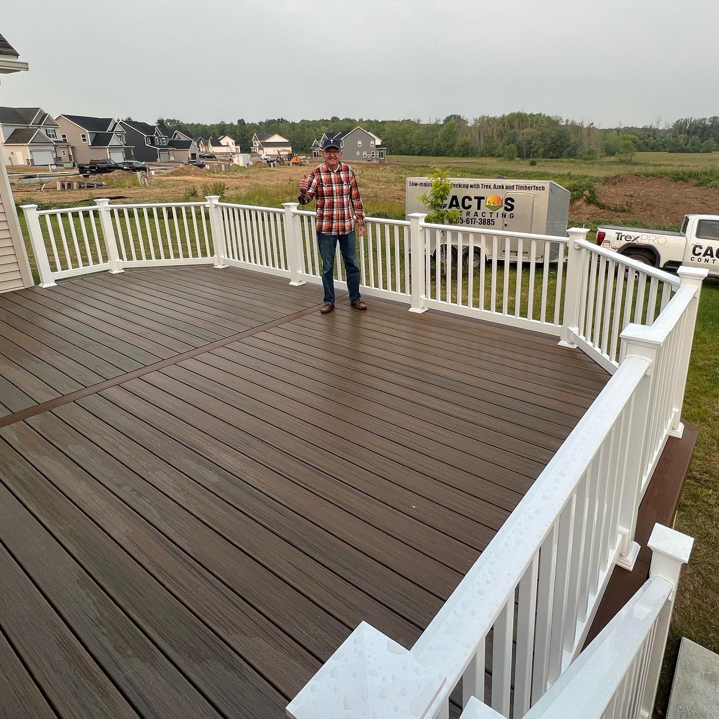 Satisfied Customer Standing on the New Deck