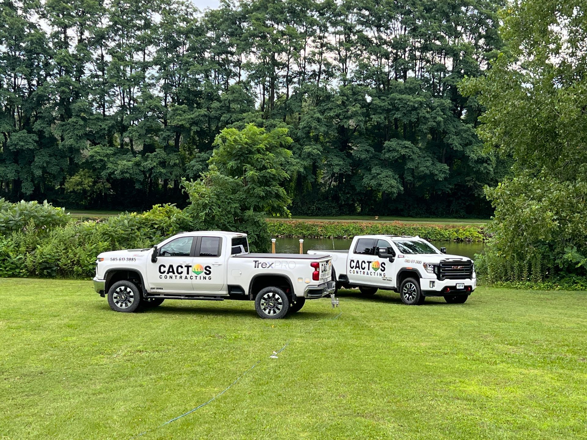 Two white trucks with 