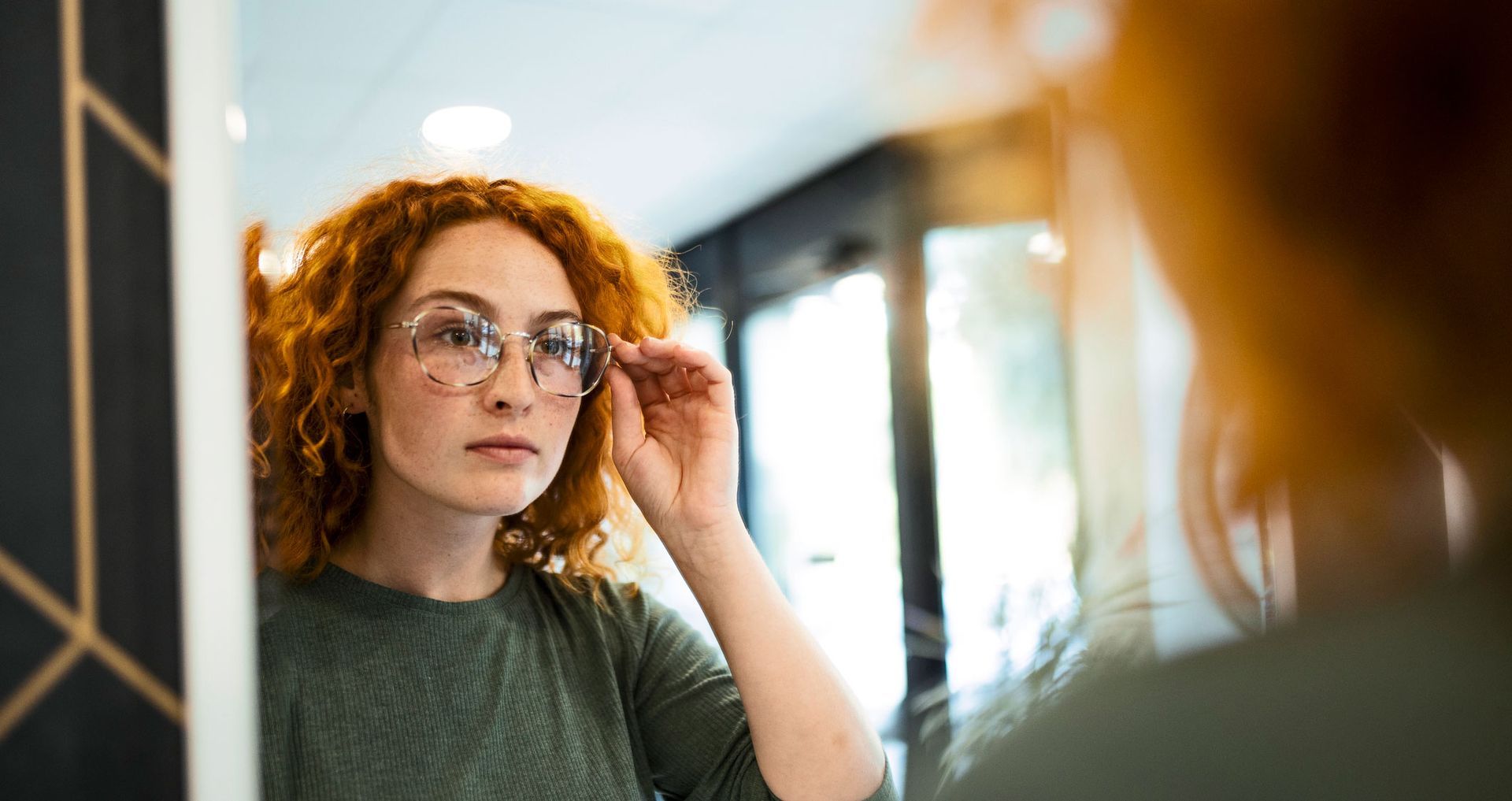 Woman Trying Eyeglass — Evesham, NJ — Tristate Eyecare