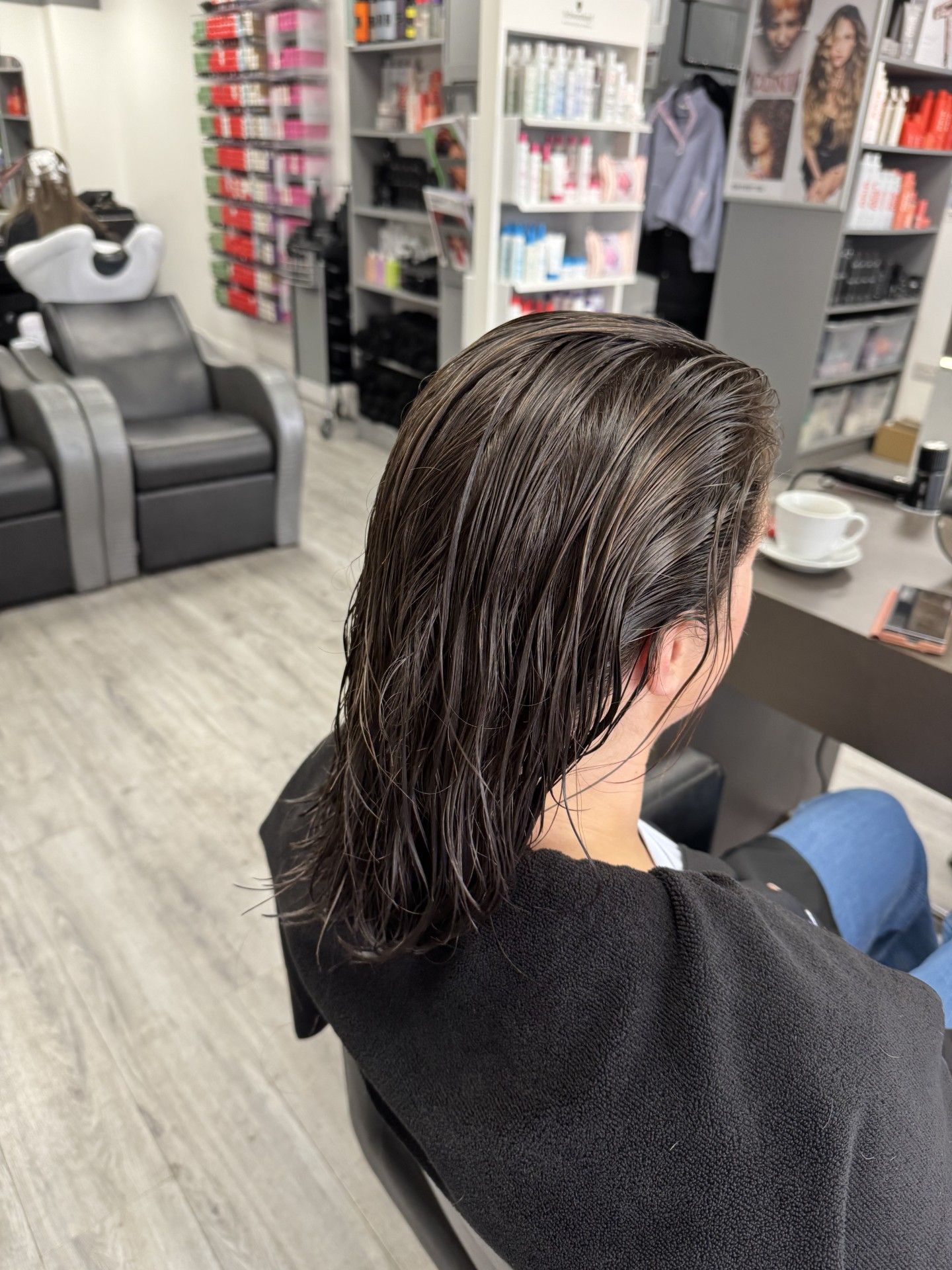 Straight wet hair before a consultation-led perm service