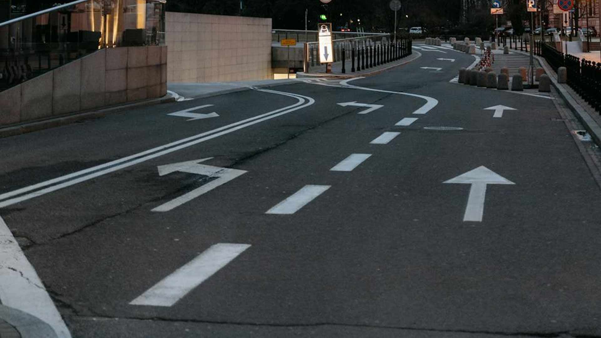 A street with white arrows painted on it