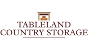 The logo for tableland country storage shows a fireplace with boxes in it.