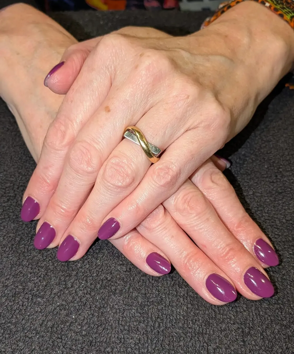 Glossy plum purple manicure at The Pamper Lounge