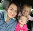 A photo of a mother and her daughters