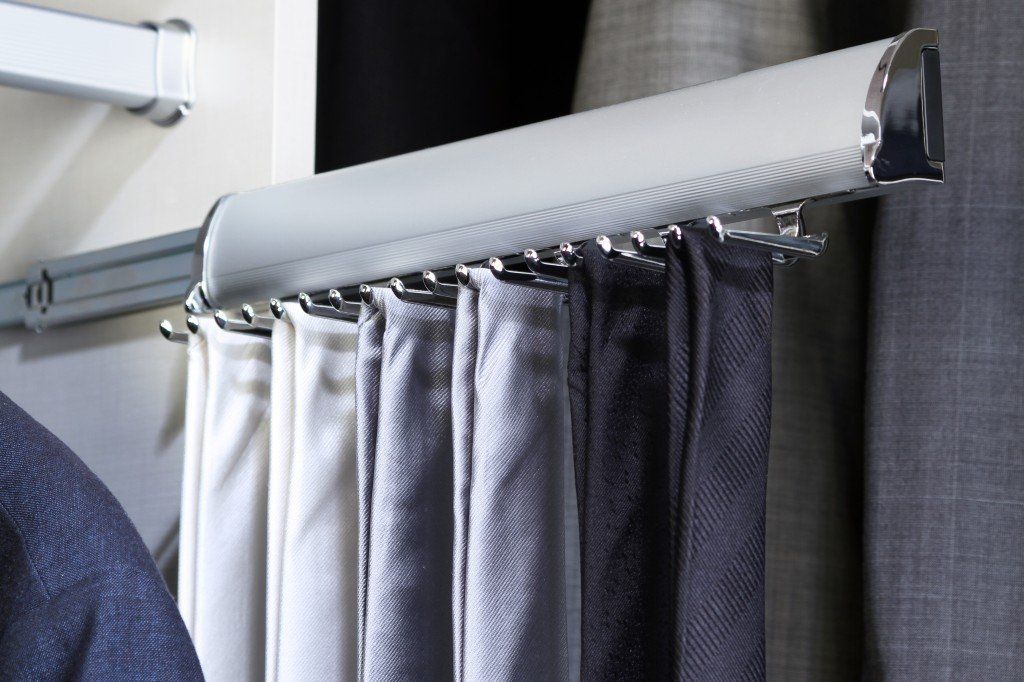 a tie rack storing multiple different colored ties