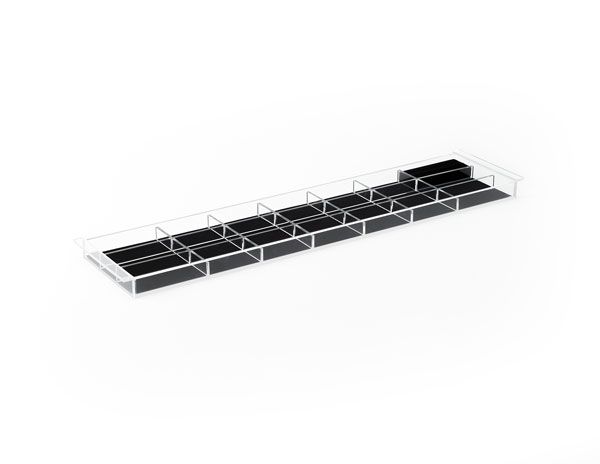 a clear acrylic tray with black dividers on a white background .