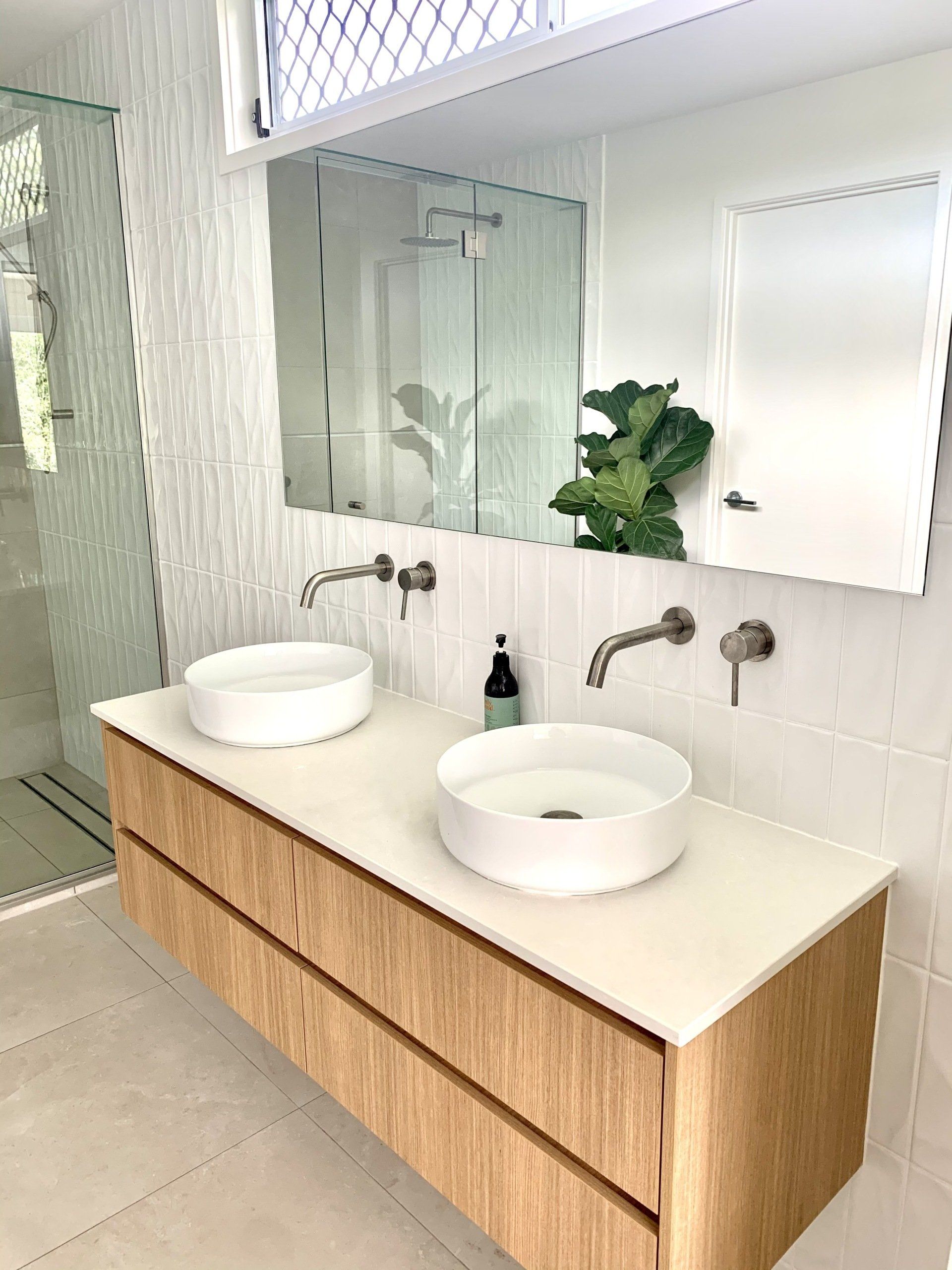 Large Mirrors In A Hallway — Suncoast Shower & Security Screens in Marcoola, QLD Large Mirrors In A Hallway — Suncoast Shower & Security Screens in Marcoola, QLD