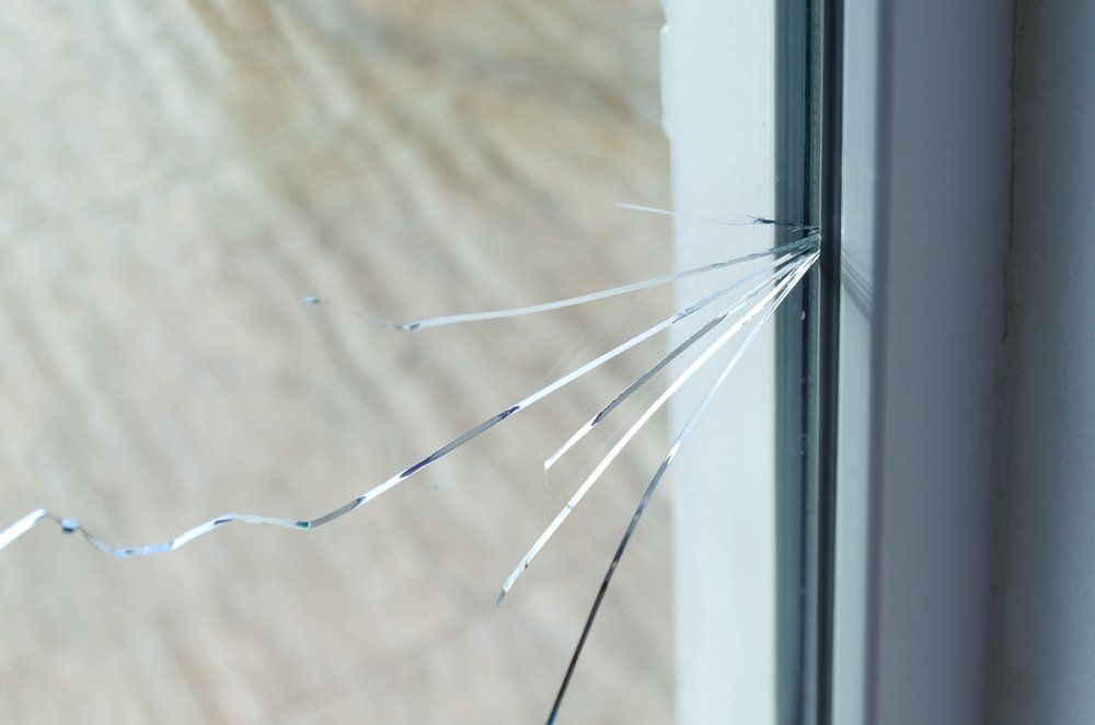Crack On The Glass At A Residential House — Suncoast Shower & Security Screens in Marcoola, QLD