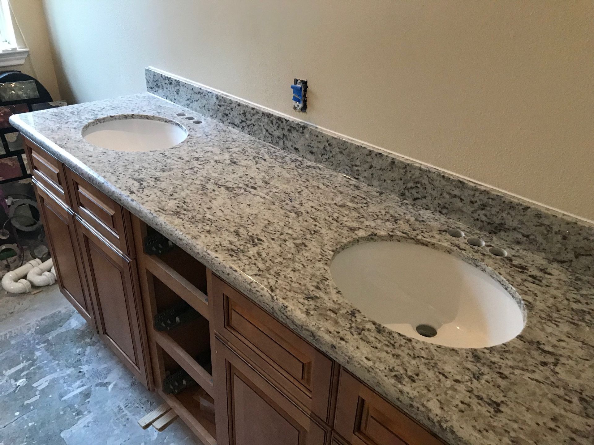 Double vanity bathroom countertop with two sinks and speckled granite top