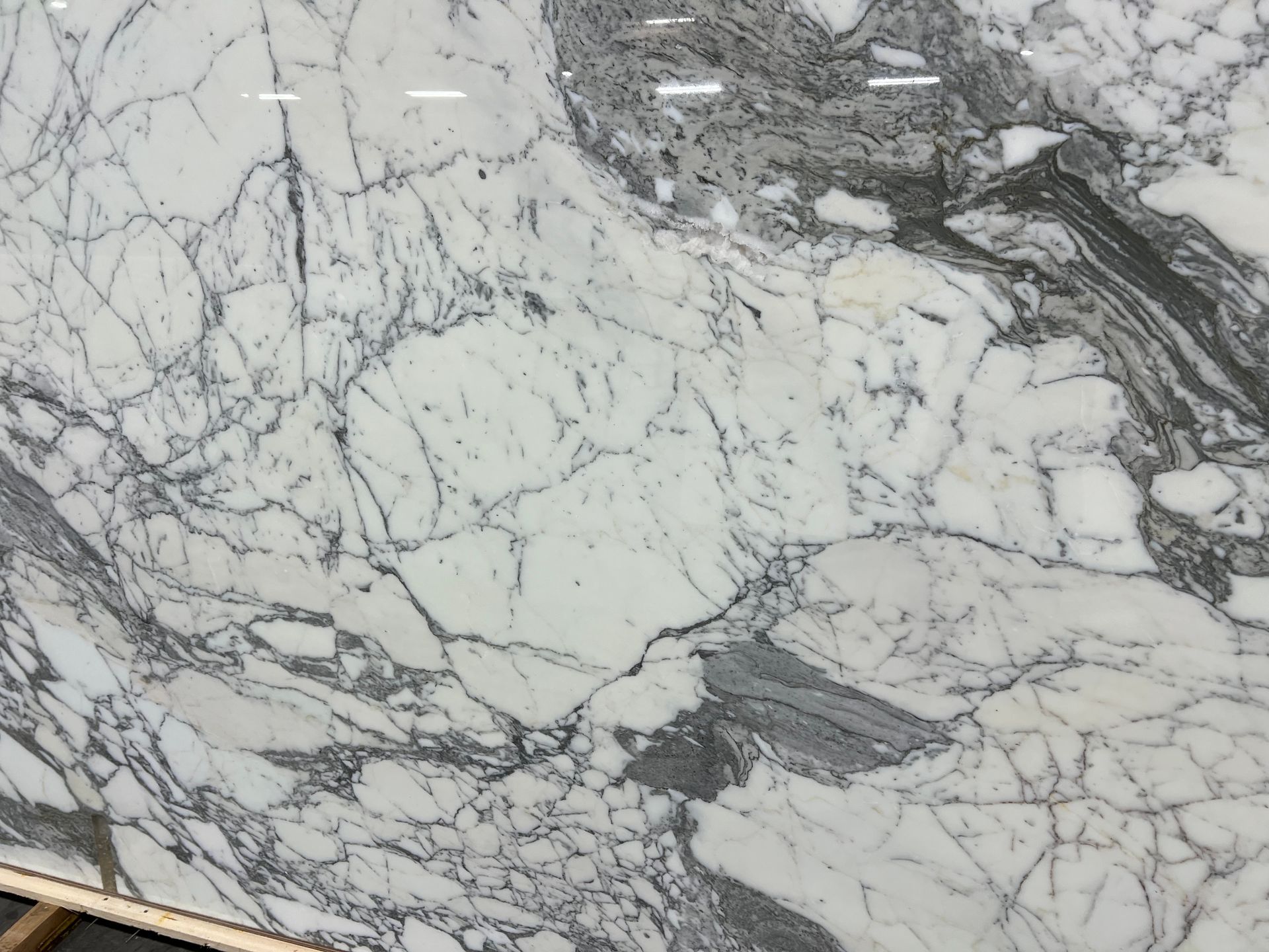 White and gray marble surface with dark veining patterns