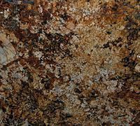 Close-up of mottled brown, tan, and black speckled stone surface