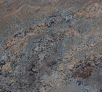 Abstract close-up of mottled gray, brown, and blue stone texture