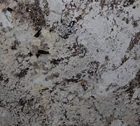 Close-up of a gray granite surface with black and white speckled patterns