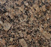 Close-up of speckled granite with brown, black, and beige flecks