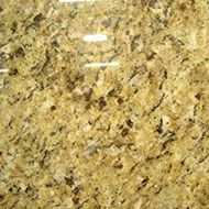 Close-up of polished beige and gold speckled granite countertop surface