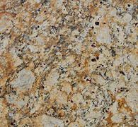Close-up of speckled granite countertop with beige, gray, and black flecks