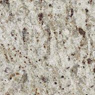 Light beige granite with dark speckles and streaks in a close-up texture pattern