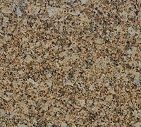 Close-up of speckled beige and brown stone or granite surface