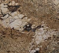 Close-up of a brown and cream speckled stone surface with dark veining