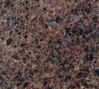 Abstract close-up of a brown, black, and pink speckled textured surface