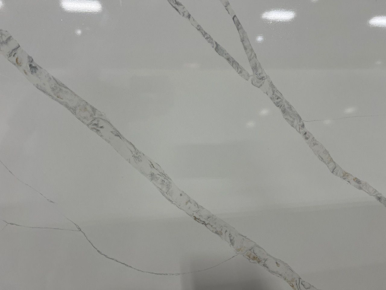 Light gray marble surface with diagonal white and dark veining